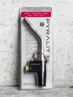 Pyralit adjustable torch in packaging on a textured gray background